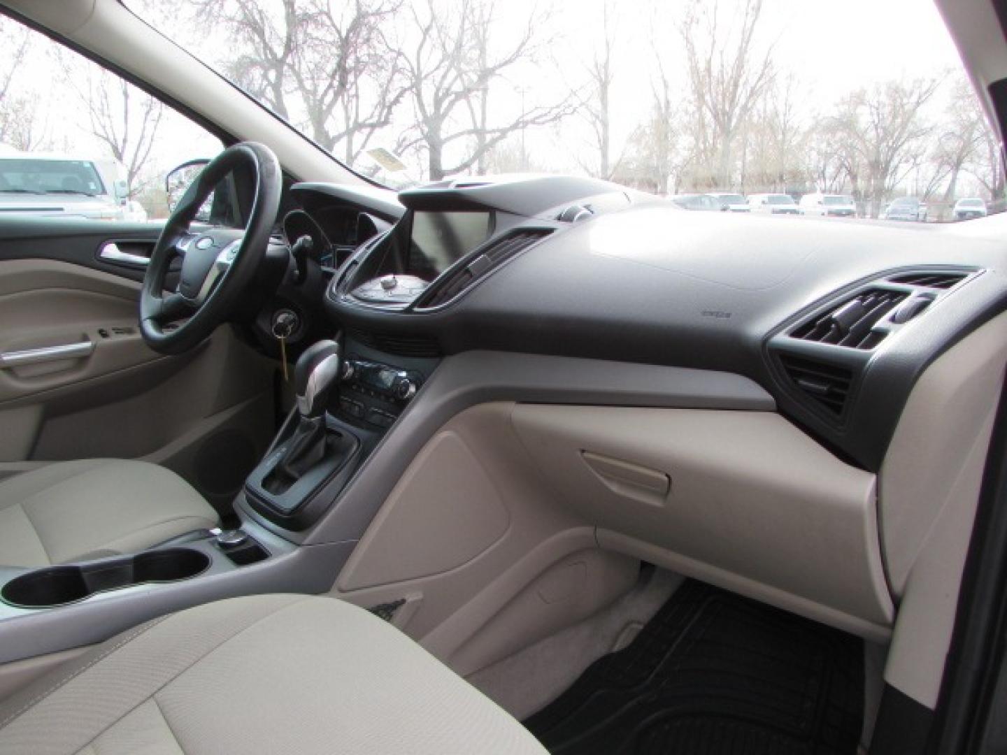 2015 Gray /Tan Ford Escape SE (1FMCU9G96FU) with an 2.0 I4 Ecoboost turbo engine engine, 6 speed automatic transmission, located at 4562 State Avenue, Billings, MT, 59101, (406) 896-9833, 45.769516, -108.526772 - 2015 Ford Escape SE 4WD 2.0 Ecoboost Turbo 4 cylinder engine - 6 speed automatic transmission - 4WD - 151,468 miles $256 per month - payment example based on $1000 cash or trade down - 36 months at 7.99 percent APR - on approved credit SE package - air conditioning - tilt and steering wheel - Photo#14